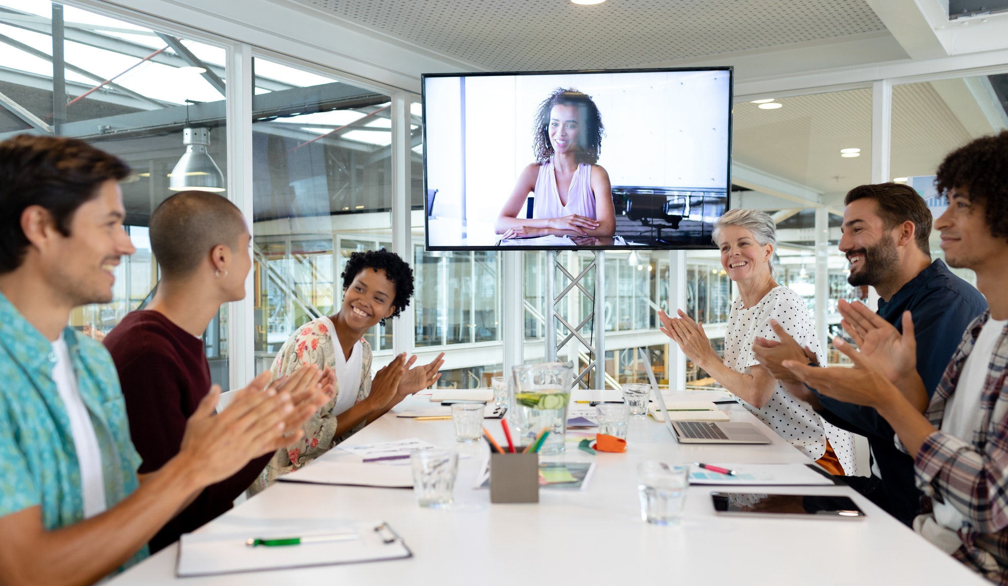 Diverse business people attending video conference at conference room